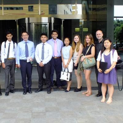A group of teenagers stand outside their placement on the Projects Abroad Law and Business internship in China High school students stand outside a local lawfirm on their Law and Business internship in China